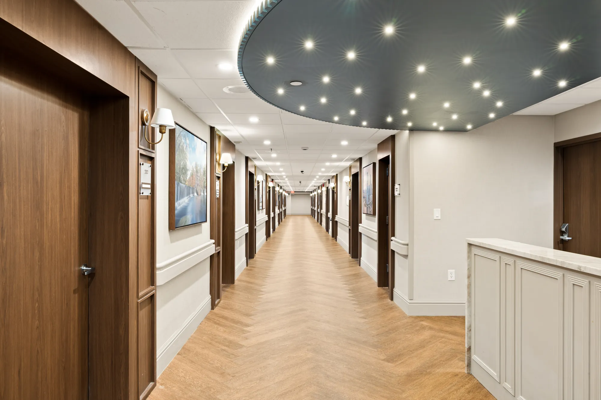 A renovated Amara corridor with a recessed ceiling of pinpoint lights running its full length