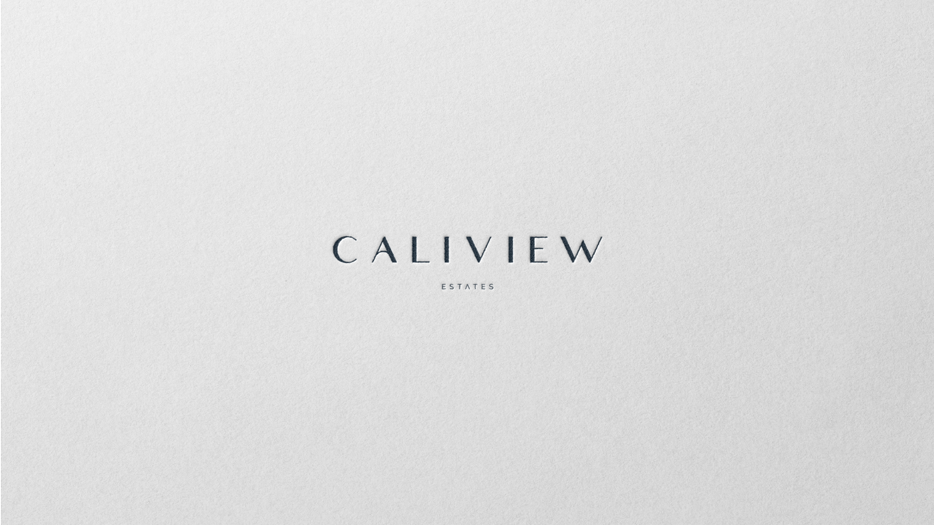 Caliview Estates wordmark blind-embossed on white textured paper