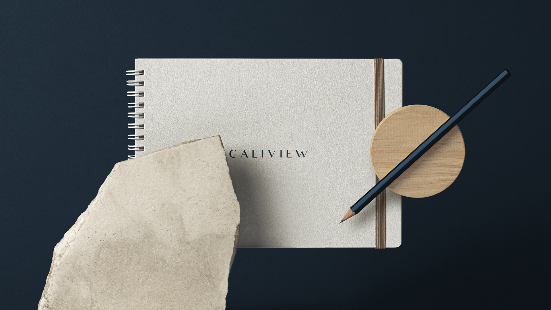 Open Caliview Estates ring binder showing a house rendering beside a location page