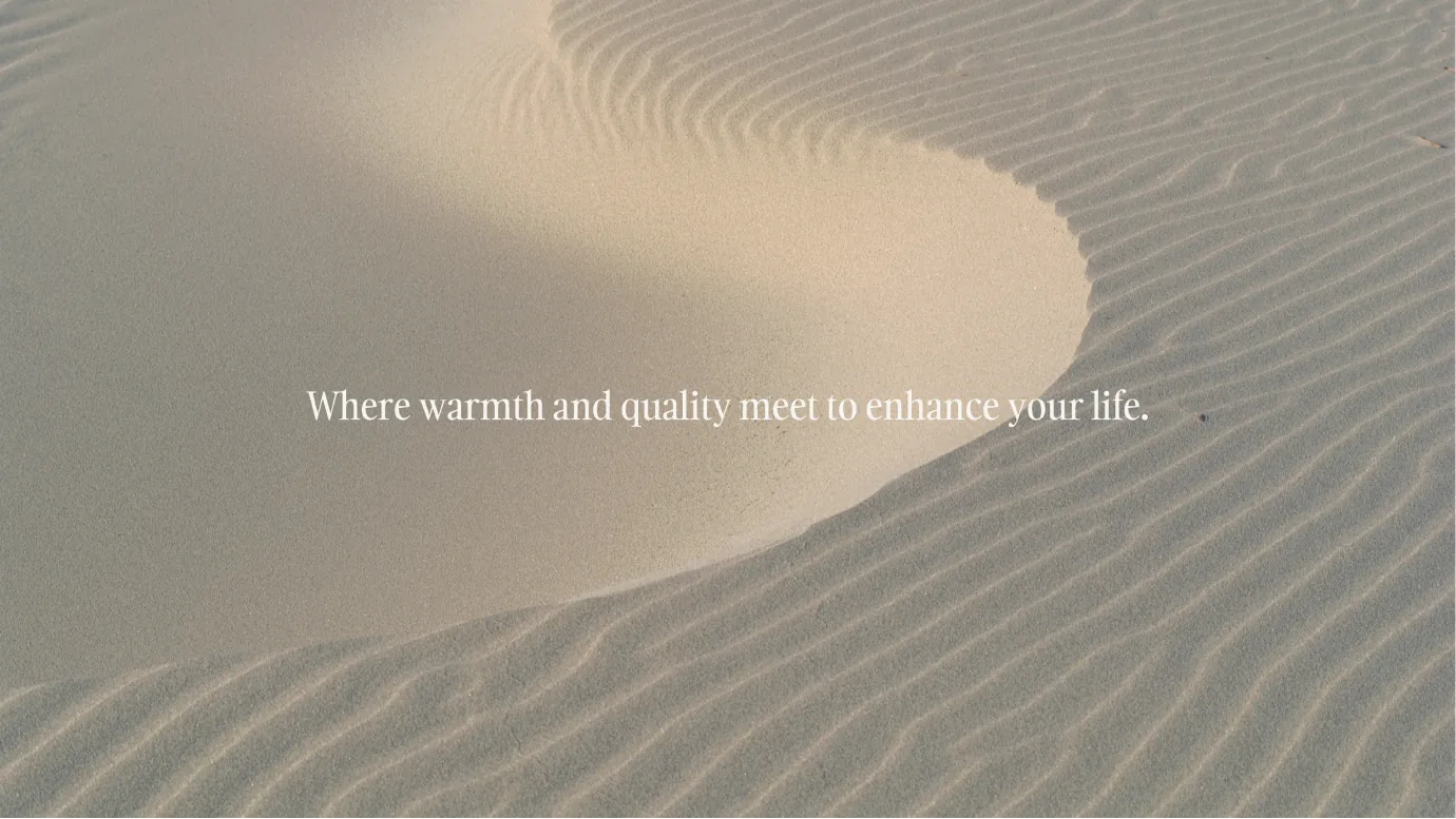 Carlton Shores tagline shot, where warmth and quality meet to enhance your life, on rippled sand