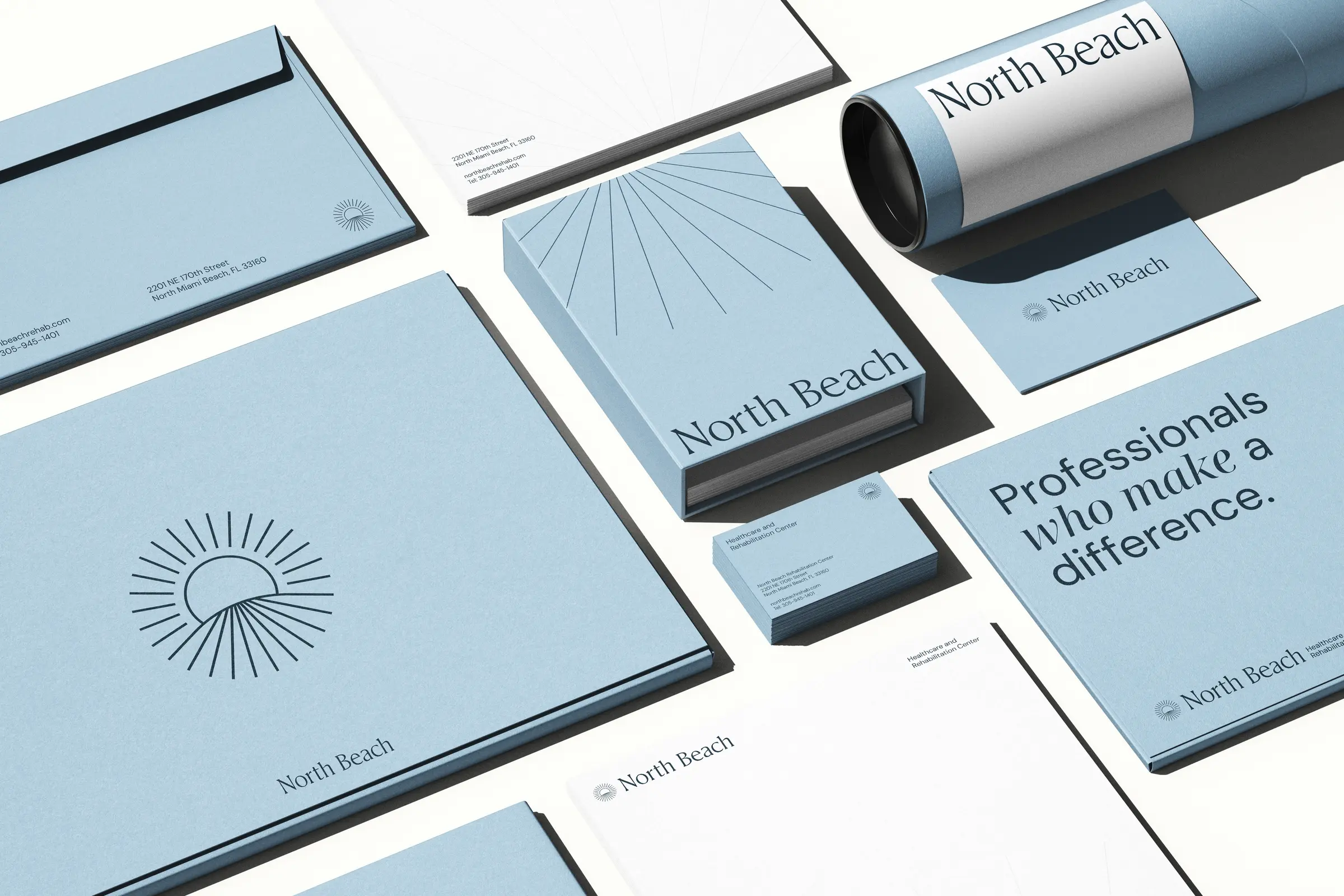 Palms stationery system in soft green, including envelopes, letterhead, folders, and business cards
