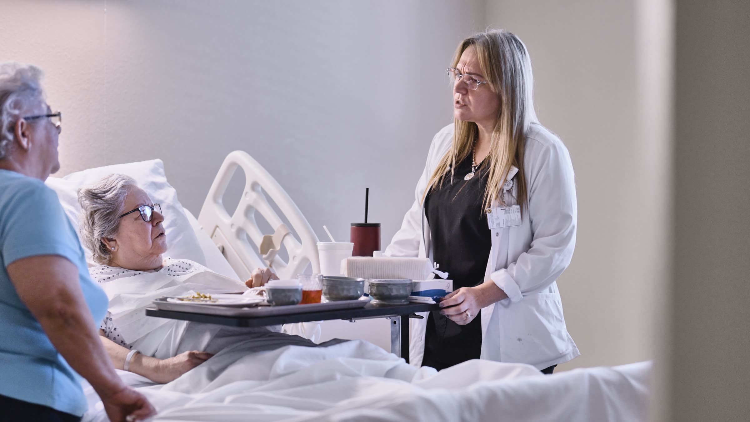 Administrator reviewing care notes with a staff nurse