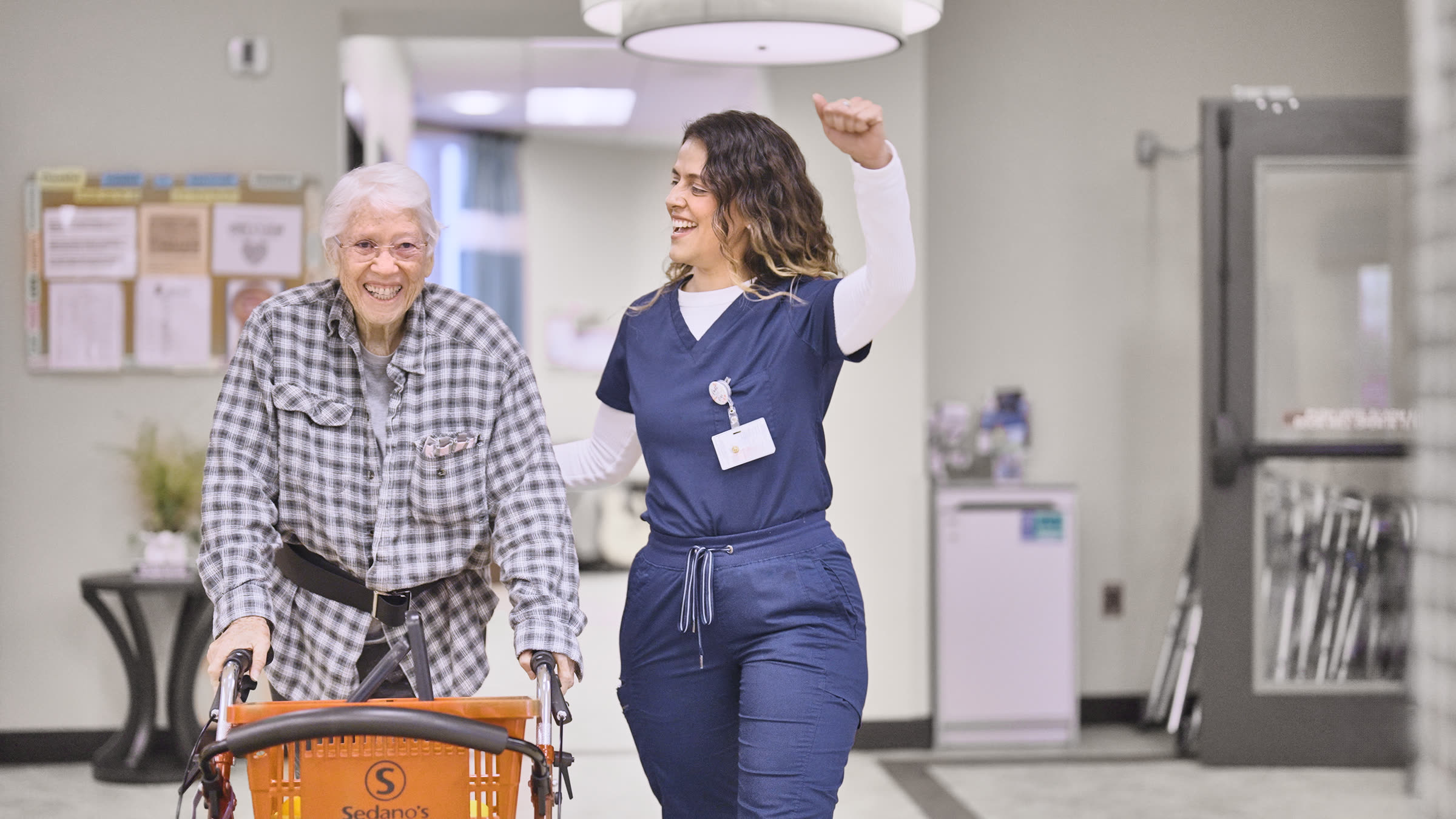 Resident graduation moment with care team applauding