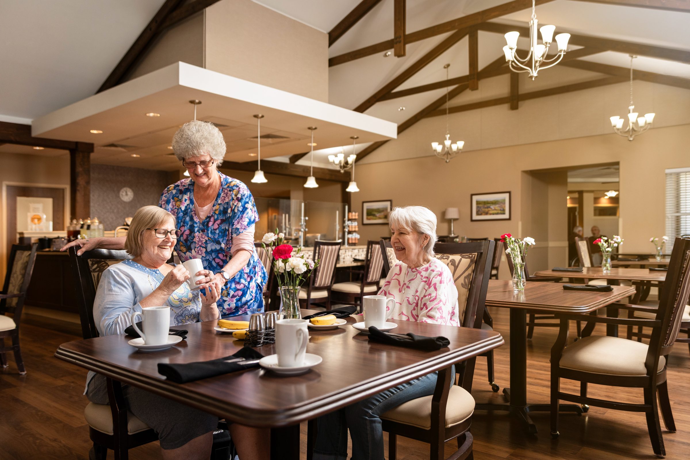 Oak Glen residents sharing morning coffee in the dining hall