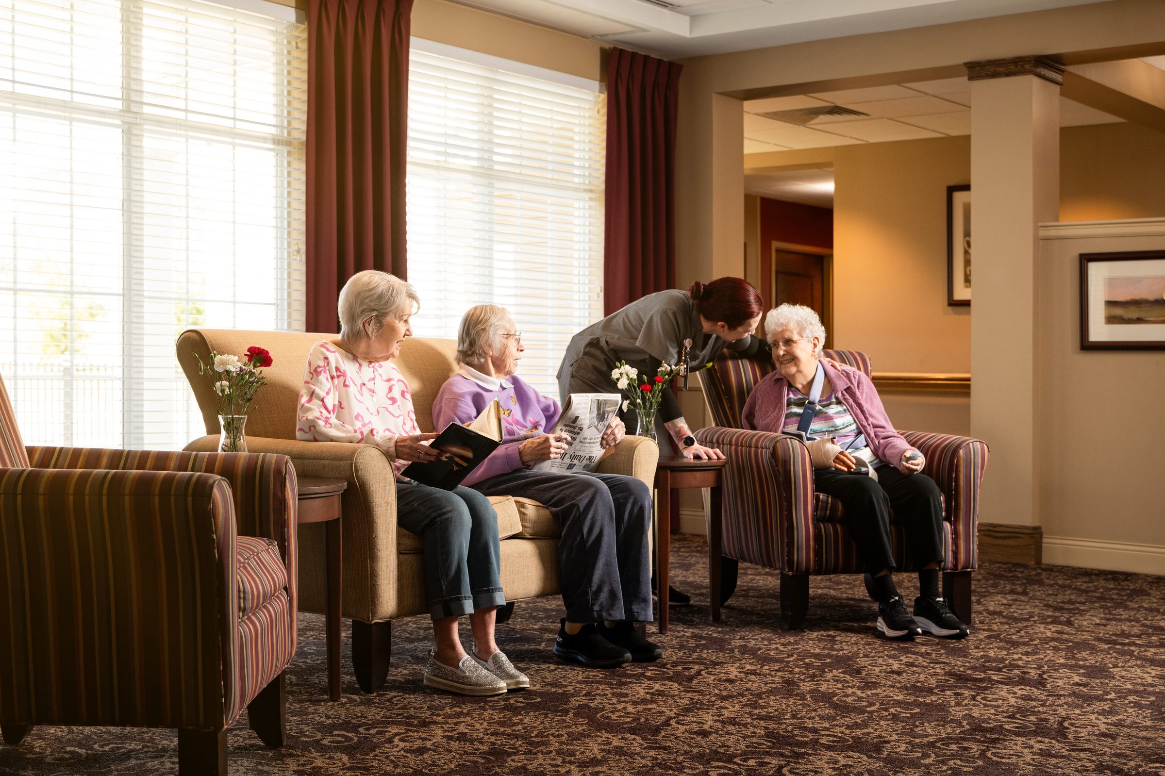 Oak Glen residents at a corner table in the dining room