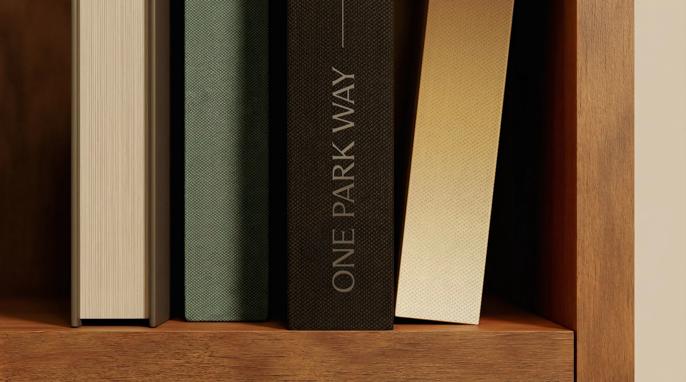One Park Way book spines, embossed wordmark on shelf
