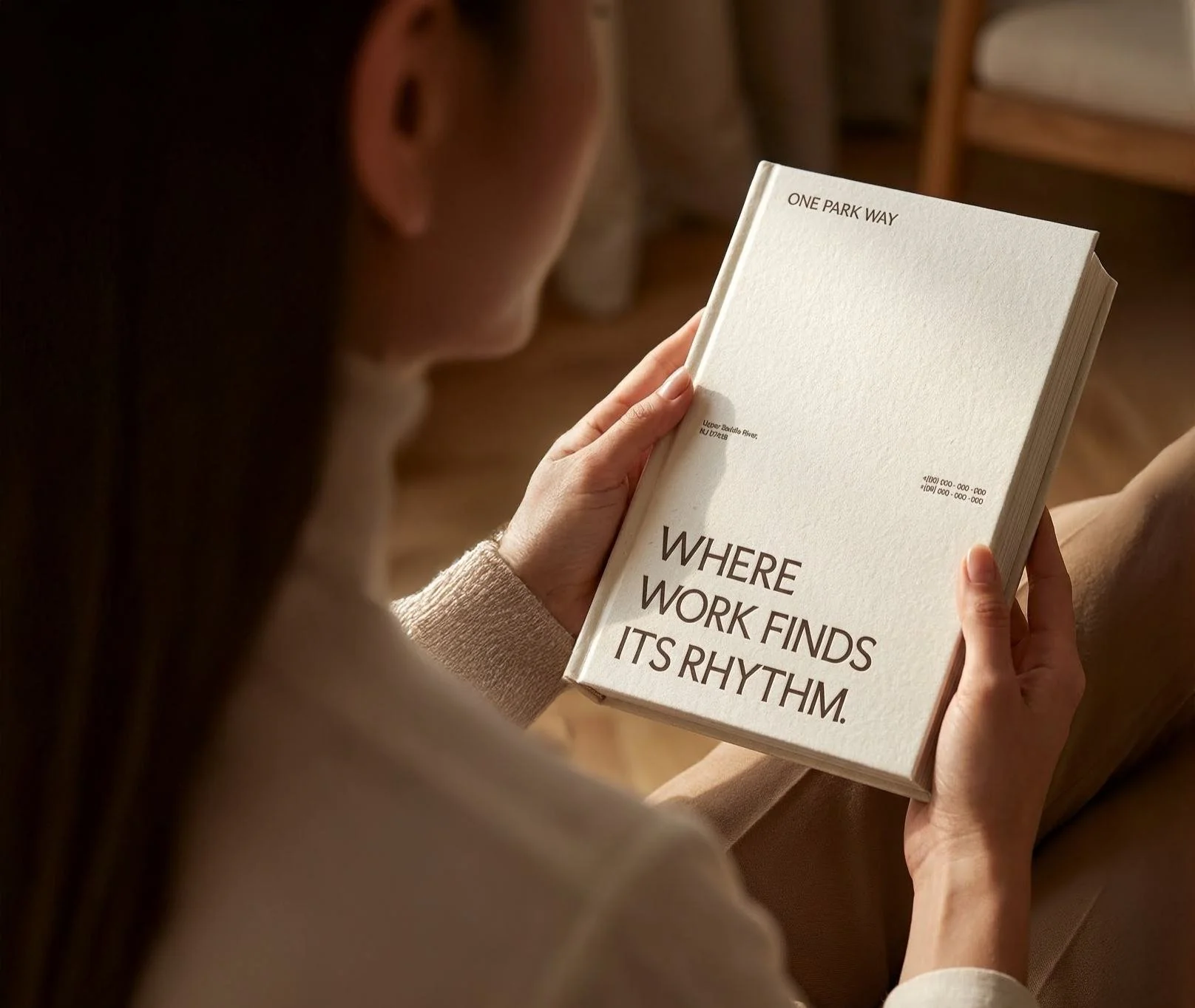 One Park Way book held, Where work finds its rhythm cover