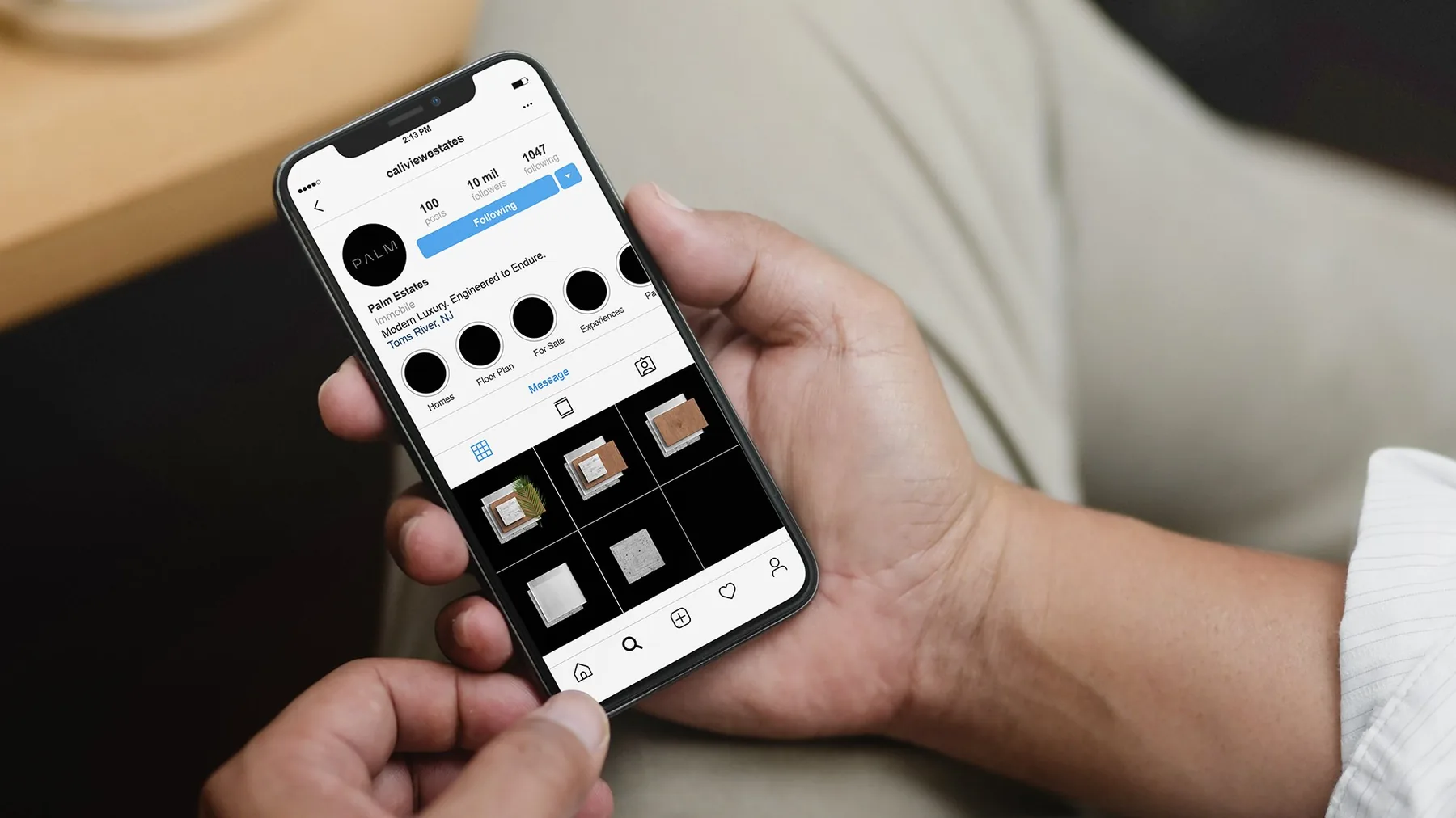 Palm Estates Instagram profile shown on a phone in a buyer’s hand, grid of brand and materials posts