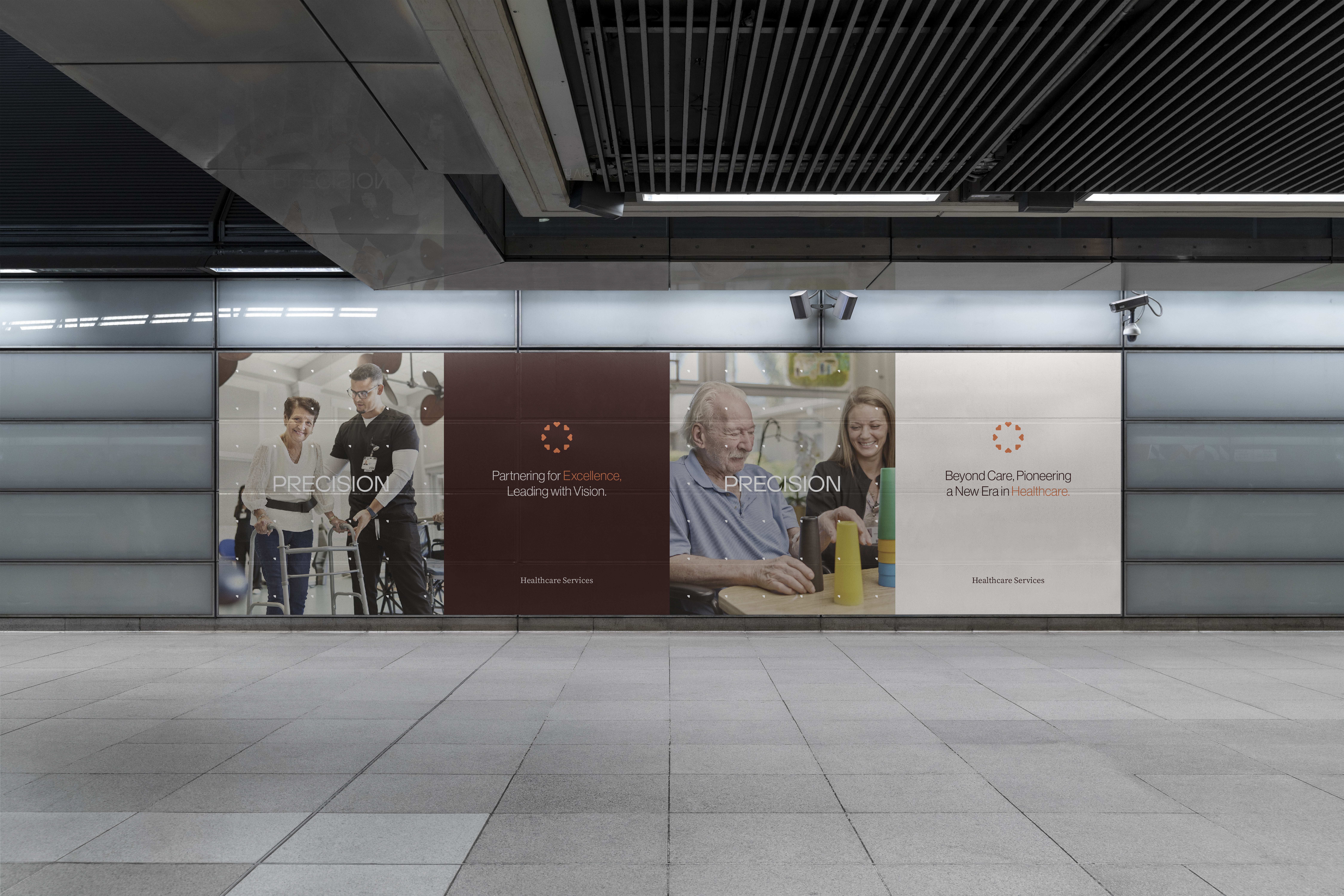 Station concourse window wall with Precision campaign panels showing rehabilitation and therapy care