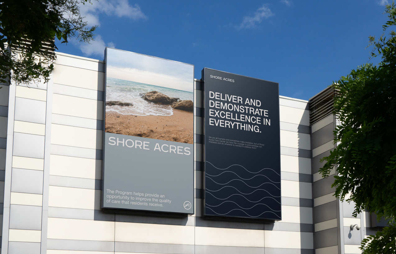 Two Shore Acres building banners, one with a shoreline photograph and one reading Deliver and demonstrate excellence in everything