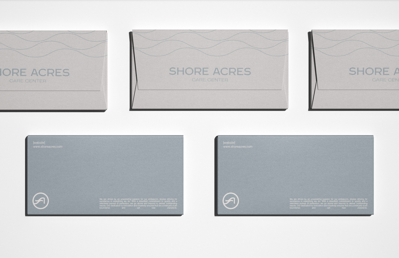 Row of Shore Acres envelopes and cards printed with the wave line pattern