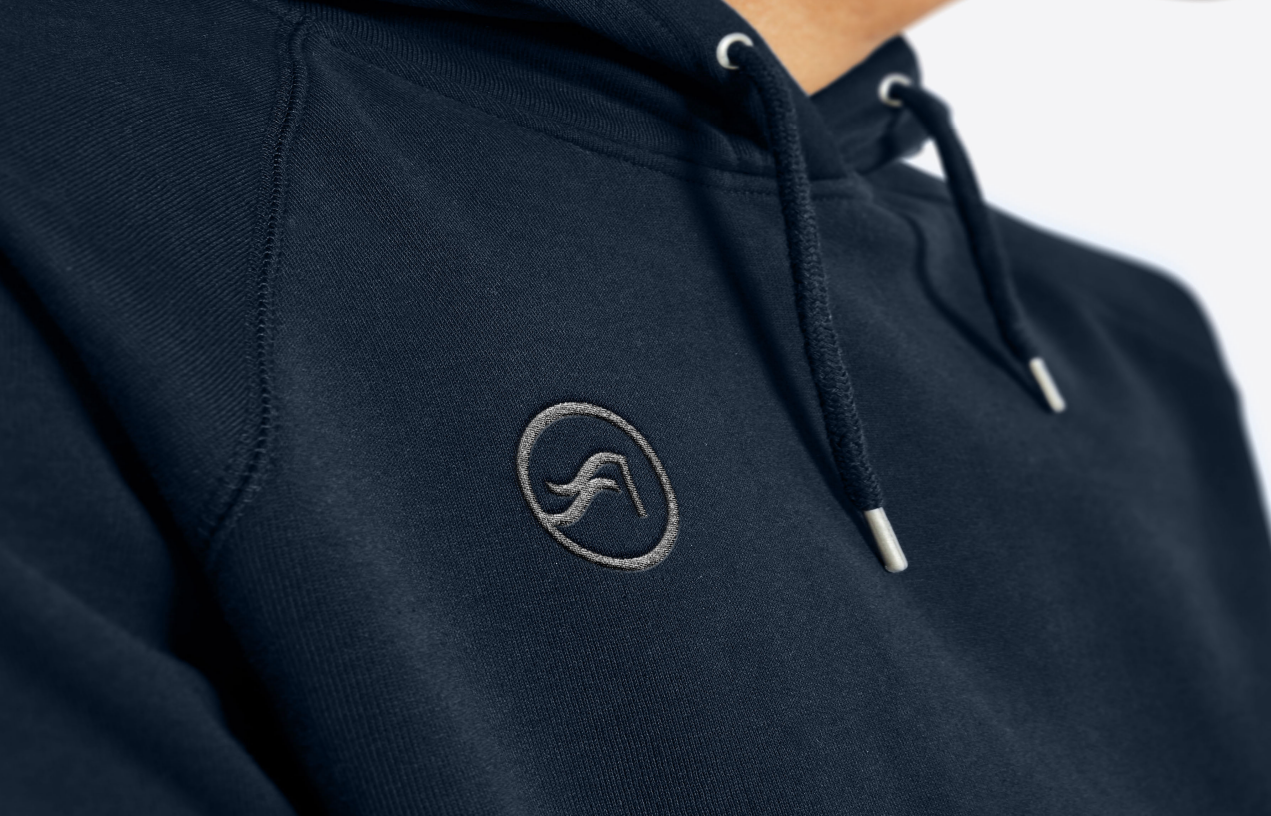 Navy Shore Acres hoodie with the wave monogram embroidered tonally on the chest