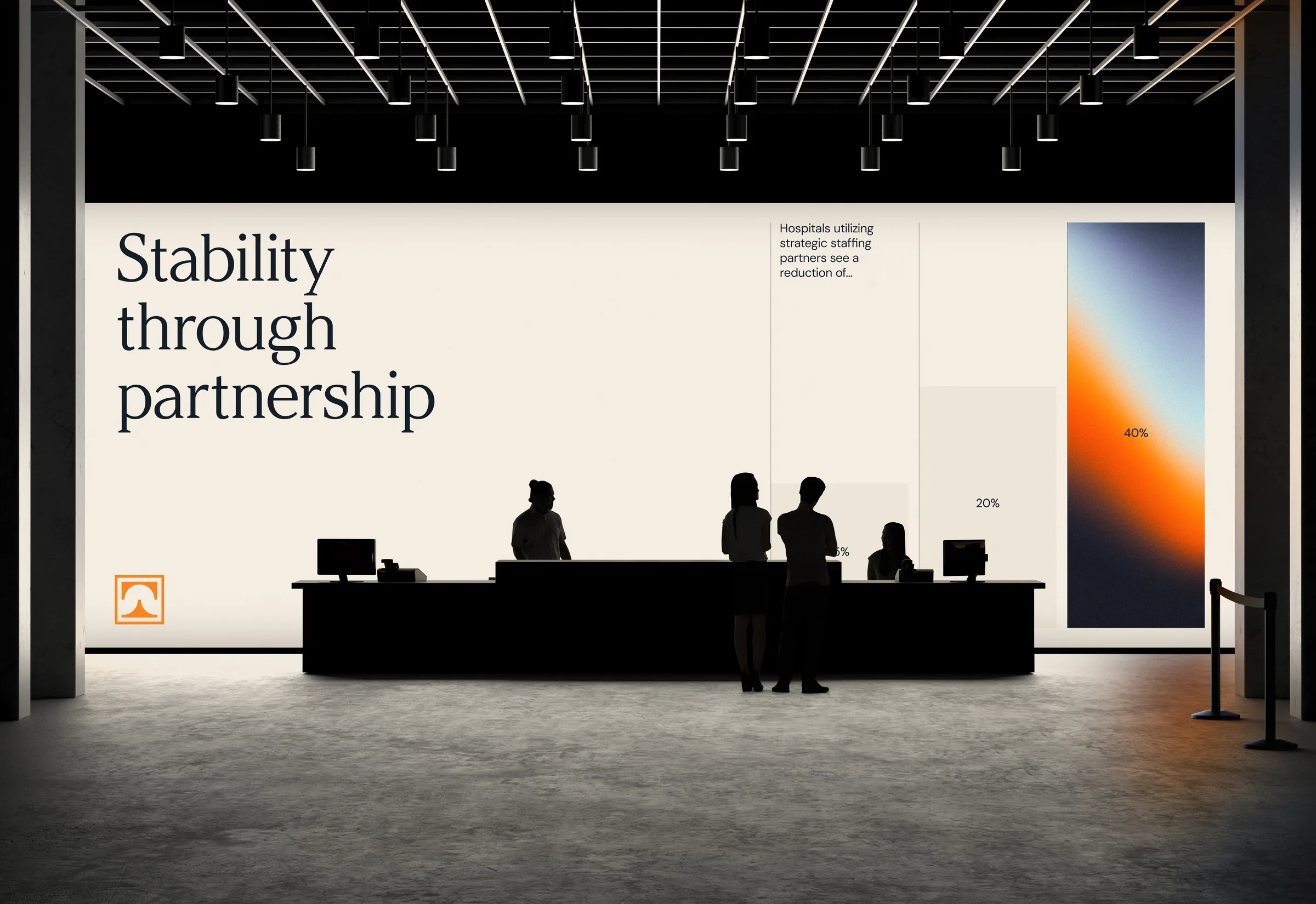 Towne Group lobby reception desk against a wall graphic reading Stability through partnership, beside a hospital staffing chart