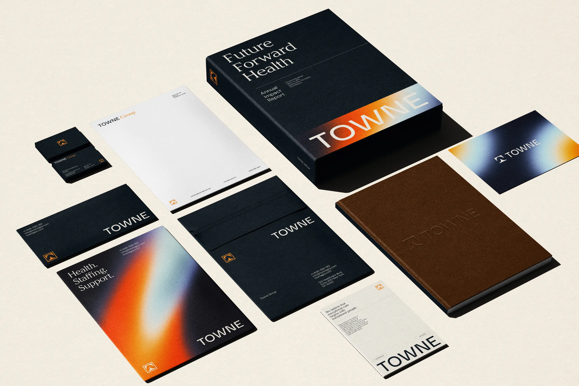 Towne Group stationery suite: business cards, letterhead, envelopes, a report slipcase, and an embossed notebook