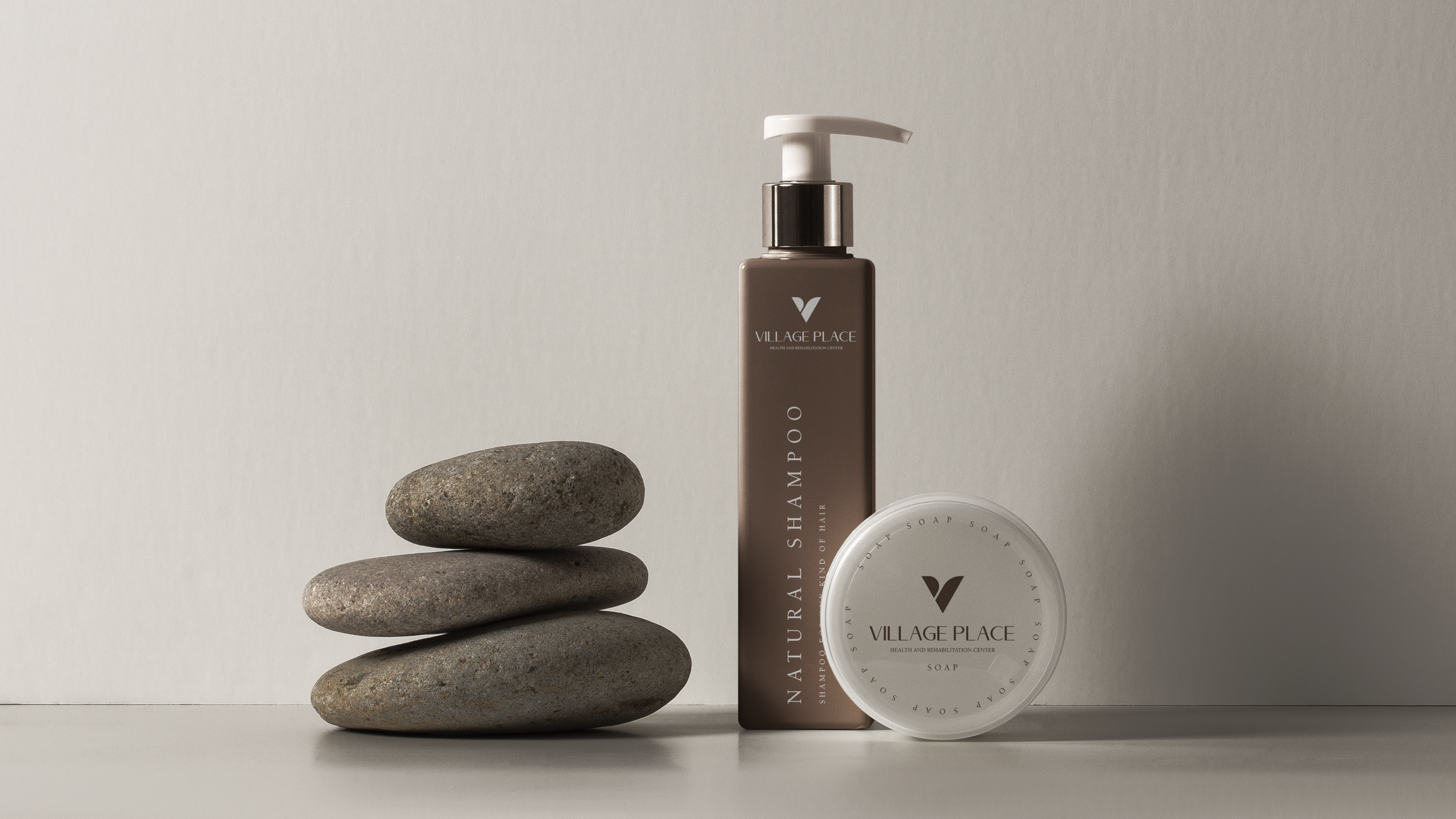 Village Place natural shampoo bottle and soap puck with stones