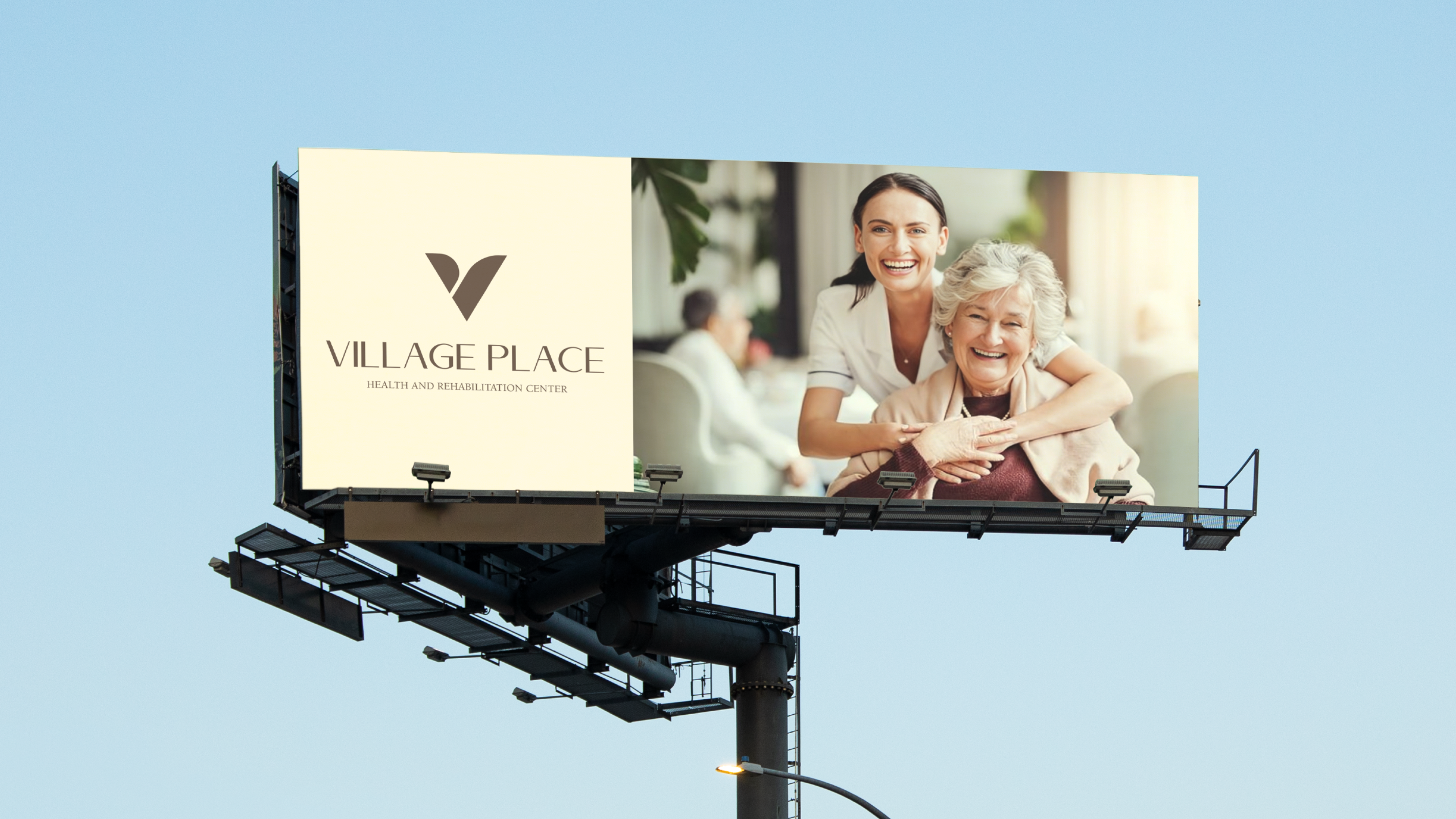 Village Place billboard with cream brand block and caregiver embracing a senior resident