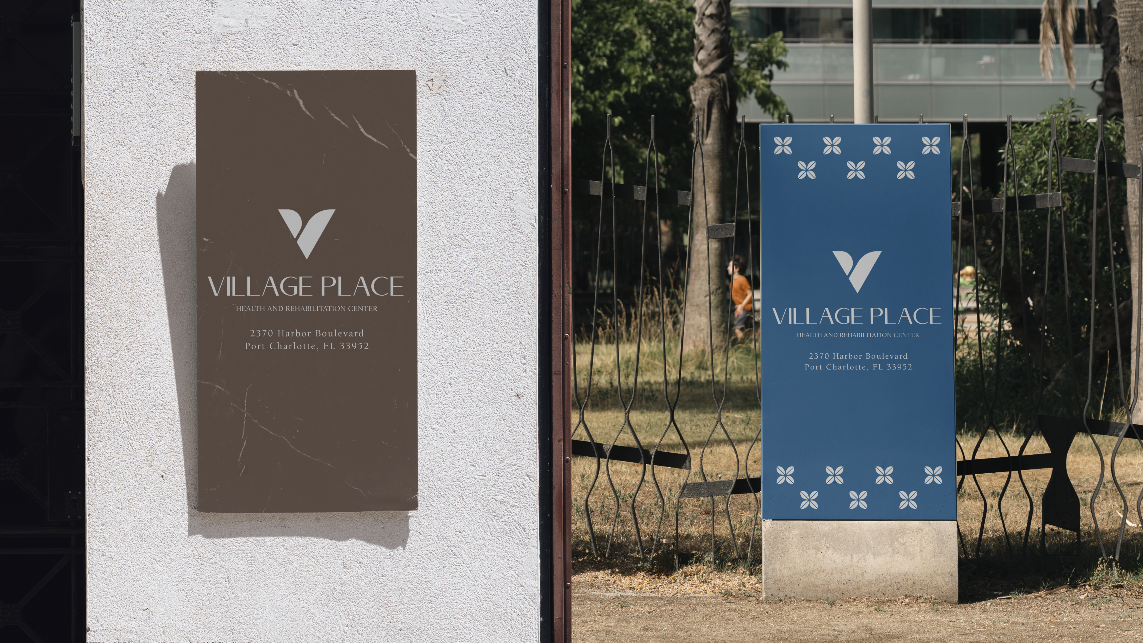 Village Place exterior monolith signs, brown wall plaque and blue freestanding marker with address